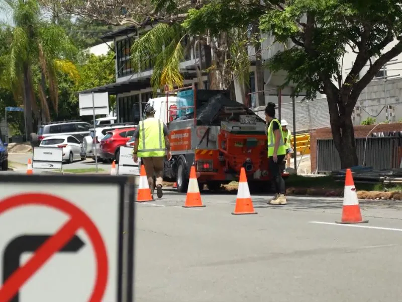 Traffic management roadwork setup with cones on an urban street